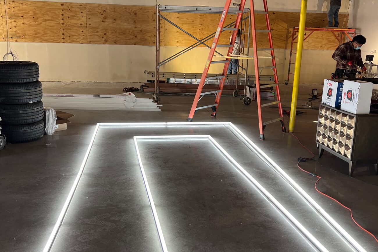 Testing out the lighting before the hanging process begins.