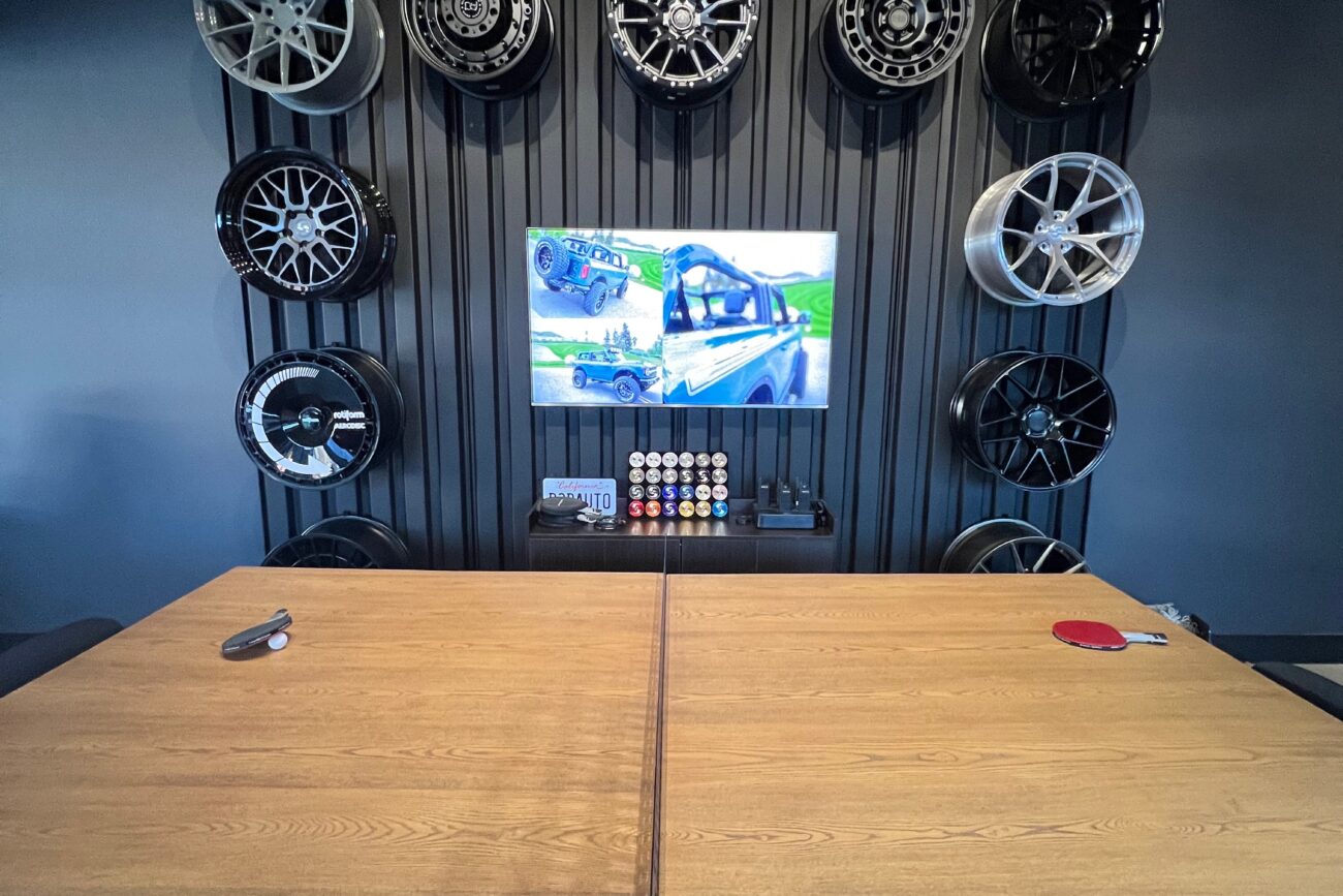 This is our wheel display wall and our conference/ping-pong table. Come on by, we can play a game or plan your next build!